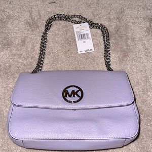 NWT Michael Kors Fulton Lilac Shoulder bag. Never worn tissue paper still inside
